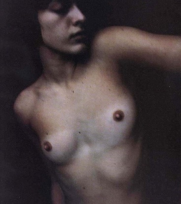 Milla Jovovich small tits photos