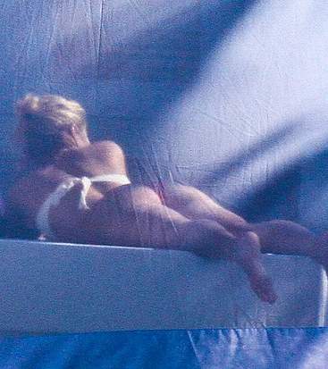 Shakira sunbathing