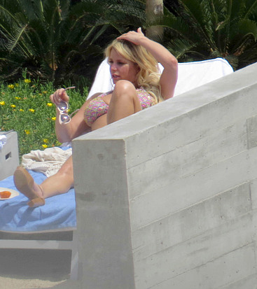 Jessica Simpson sunbathing
