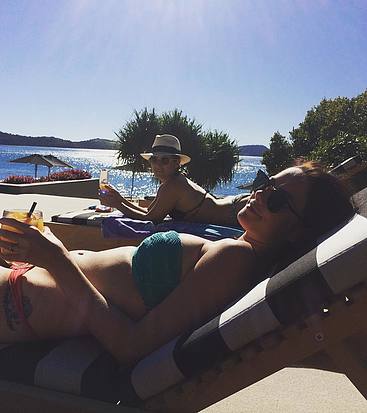 Kaya Scodelario sunbathing