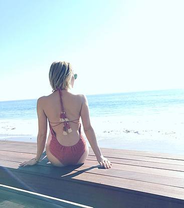 Emma Roberts sunbathing