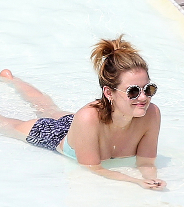 Lucy Hale sunbathing