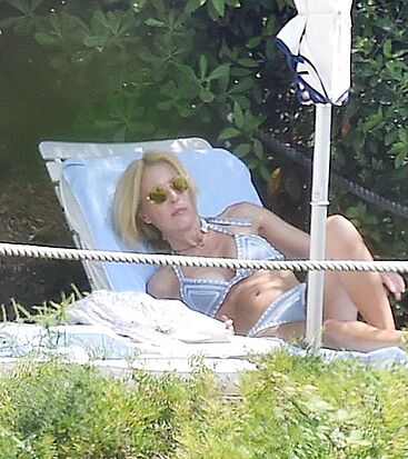 Gillian Anderson sunbathing